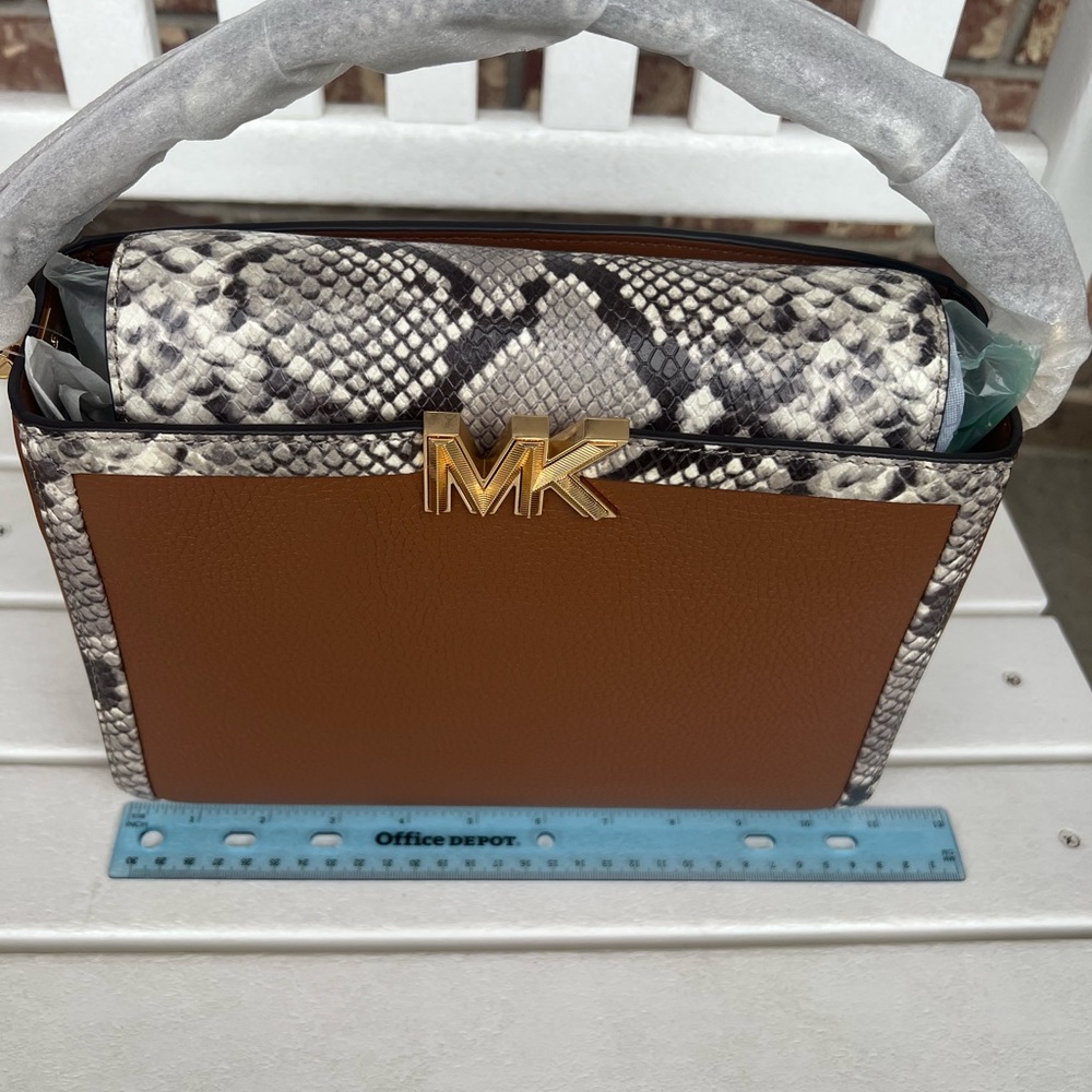 Michael Kor Karlie luggage Md satchel leather with snake print.
